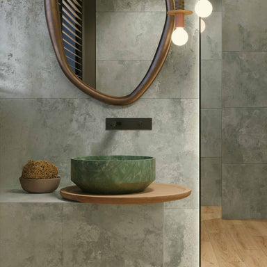 bathroom room setting image with green tiles