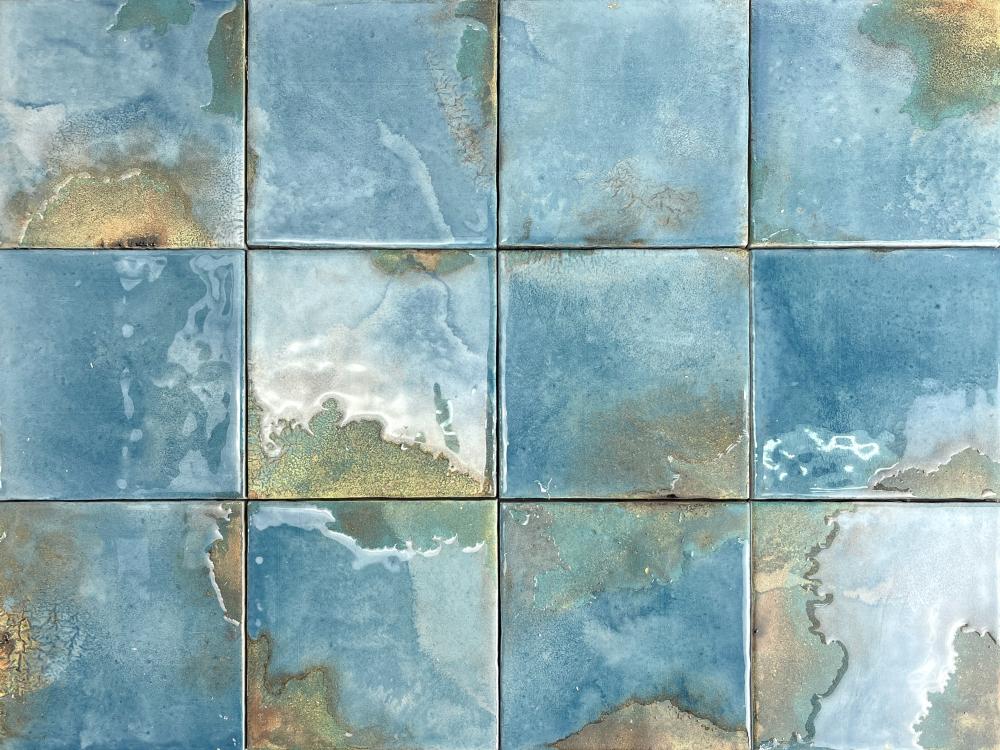 Grid of ceramic tiles with a blue and green marbled pattern