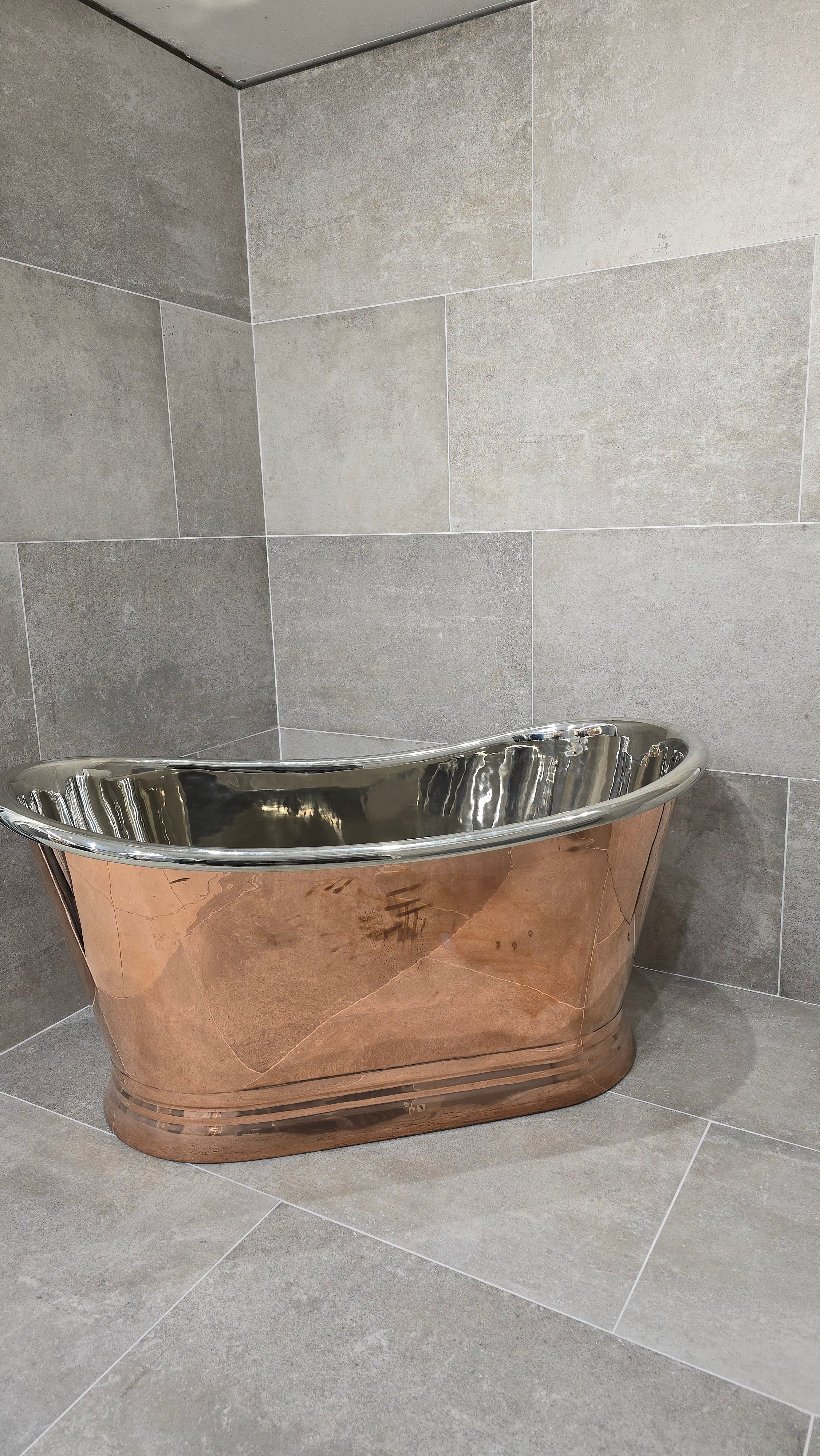 copper bath in tiled display