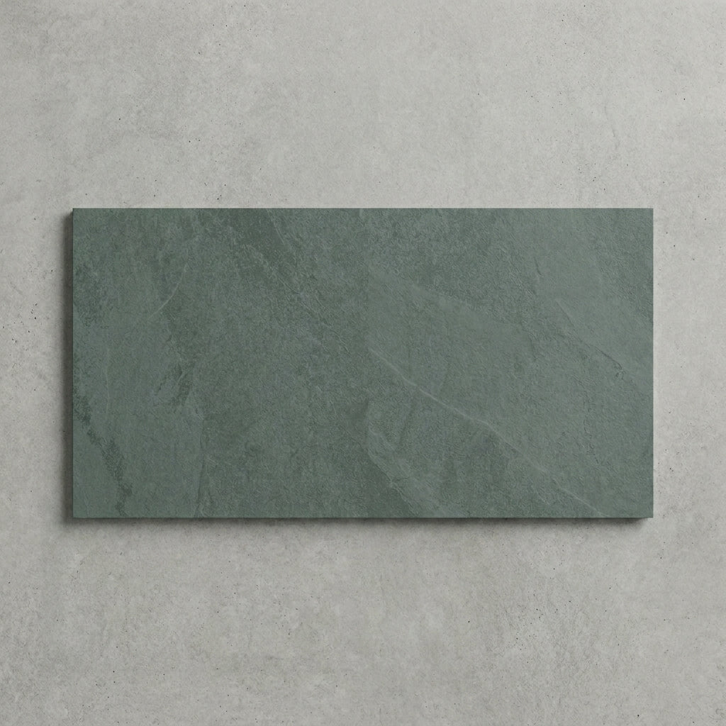 Rectangular green slate tile on a gray background