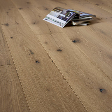 Wooden floor with a magazine lying on it